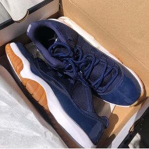 Air Jordan 11s retro low navy blue gum bottom. Brand new never worn.